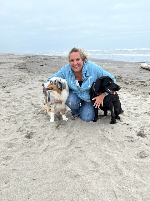 Picture of Jessica with dogs at the beach